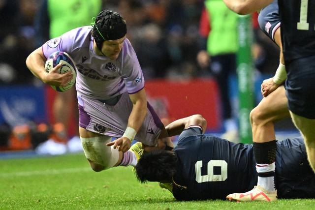 Scotland's wing Darcy Graham is tackled by USA's flanker Viliami Helu during the Autumn Nations Series international rugby union match between Scotland and USA at Murrayfield in Edinburgh on November 1, 2025. (Photo by ANDY BUCHANAN / AFP)