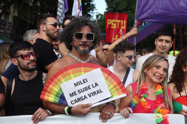 Revellers take part in the 34th Pride Parade in Buenos Aires on November 1, 2025. (Photo by Alejandro PAGNI / AFP)