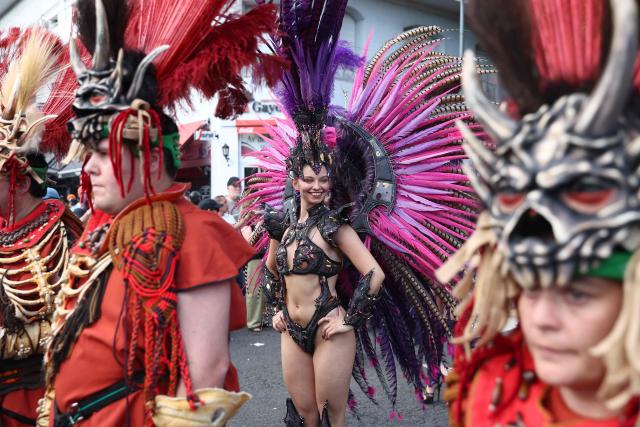Revellers take part in the 34th Pride Parade in Buenos Aires on November 1, 2025. (Photo by Alejandro PAGNI / AFP)