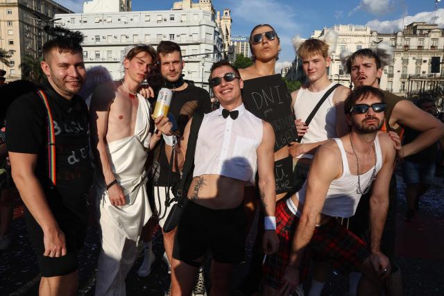 Revellers take part in the 34th Pride Parade in Buenos Aires on November 1, 2025. (Photo by Alejandro PAGNI / AFP)