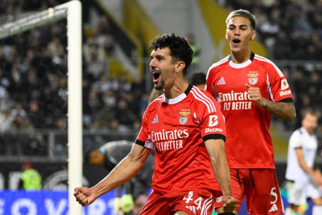 SL Benfica's Portuguese defender #44 Tomas Araujo celebrates scoring his team's first goal  during the Portuguese League football match between Vitoria Guimaraes SC and SL Benfica at Dom Afonso Henriques stadium in Guimaraes on November 1, 2025. (Photo by Miguel RIOPA / AFP)
