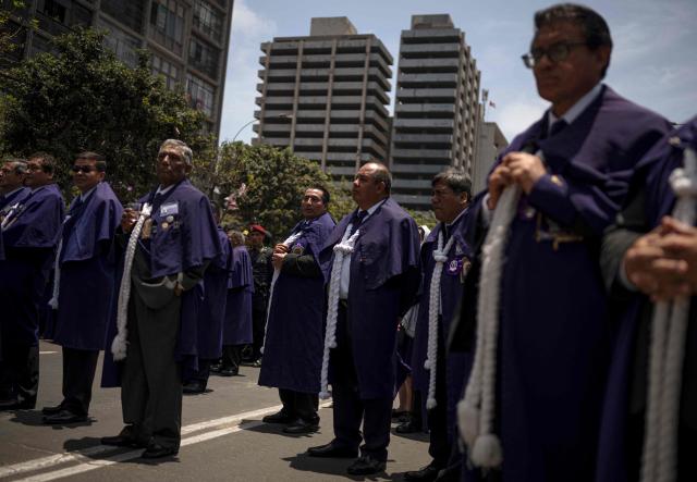 Catholic faithfuls attend the traditional Lord of Miracles procession in Lima on November 1, 2025. (Photo by ERNESTO BENAVIDES / AFP)