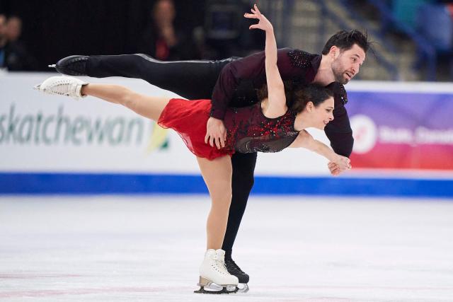 Deanna Stellato-Dudek and Maxime Deschamps of Canada skate their free program in the pairs competition during the ISU Grand Prix of Figure Skating 2025 Skate Canada International at the SaskTel Centre in Saskatoon, Saskatchewan, Canada on November 1, 2025. (Photo by Geoff Robins / AFP)