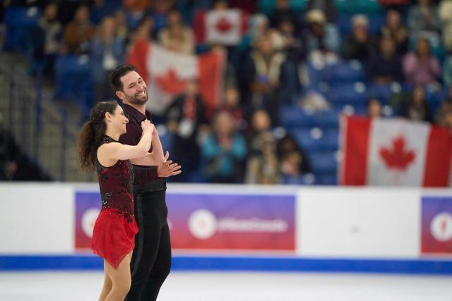 Deanna Stellato-Dudek and Maxime Deschamps of Canada skate their free program in the pairs competition during the ISU Grand Prix of Figure Skating 2025 Skate Canada International at the SaskTel Centre in Saskatoon, Saskatchewan, Canada on November 1, 2025. (Photo by Geoff Robins / AFP)