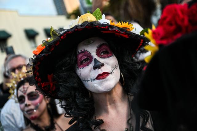 Revelers participate in a Dia de los Muertos (Day of the Dead ) celebration in Fort Lauderdale, Florida, on November 1, 2025. (Photo by CHANDAN KHANNA / AFP)