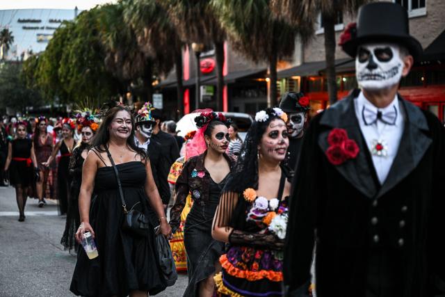 Revelers participate in a Dia de los Muertos (Day of the Dead ) celebration in Fort Lauderdale, Florida, on November 1, 2025. (Photo by CHANDAN KHANNA / AFP)