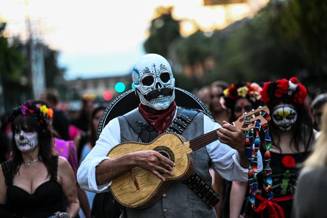 Revelers participate in a Dia de los Muertos (Day of the Dead ) celebration in Fort Lauderdale, Florida, on November 1, 2025. (Photo by CHANDAN KHANNA / AFP)