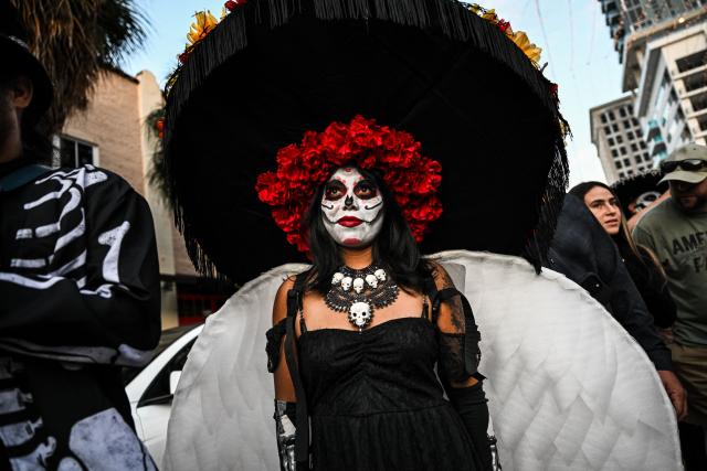 Revelers participate in a Dia de los Muertos (Day of the Dead ) celebration in Fort Lauderdale, Florida, on November 1, 2025. (Photo by CHANDAN KHANNA / AFP)