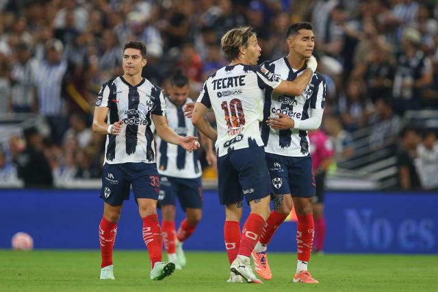 Monterrey's Spanish midfielder #10 Sergio Canales celebrates after scoring the opening goal from the penalty spot with teammate midfielder #05 Fidel Ambriz during the Liga MX Apertura football tournament match between Monterrey and Tigres at BBVA Stadium in Monterrey, Mexico on November 1, 2025. (Photo by Julio Cesar AGUILAR / AFP)