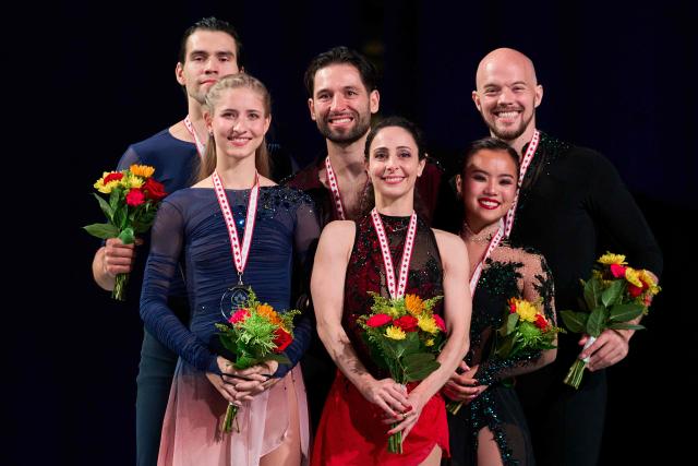 Gold medalists Deanna Stellato-Dudek and Maxime Deschamps of Canada (C) pose with silver medalists Minerva Fabienne Hase and Nikita Volodin of Germany (L) and bronze medalists Ellie Kam and Danny O'Shea of the United States during the victory ceremony for the pairs competition during the ISU Grand Prix of Figure Skating 2025 Skate Canada International at the SaskTel Centre in Saskatoon, Saskatchewan, Canada on November 1, 2025. (Photo by Geoff Robins / AFP)