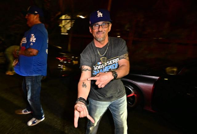 Dodgers fans celebrate in the street after their team won Game 7 of the World Series against the Toronto Blue Jays, in Los Angeles on November 1, 2025. (Photo by Frederic J. Brown / AFP)