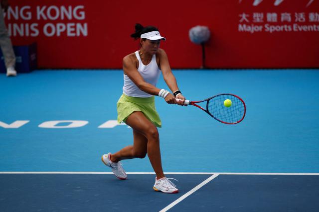 Wang Yafan of China hits a return against Momoko Kobori of Japan and Peangtarn Plipuech of Thailand  during the women's doubles final match in the Hong Kong Tennis Open in Hong Kong on November 2, 2025 (Photo by May James / AFP)