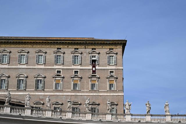 Pope Leo XIV addresses the audience from the window of the apostolic palace overlooking St. Peter's square during the Angelus prayer in The Vatican on November 2, 2025. (Photo by Andreas SOLARO / AFP)