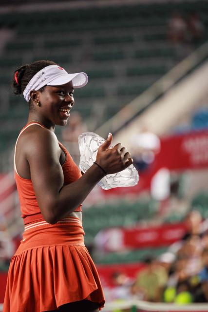 Victoria Mboko of Canada holds the trophy after winning against Cristina Bucsa of Spain in the women's singles final of the Hong Kong Tennis Open in Hong Kong on November 2, 2025. (Photo by May James / AFP)