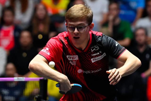 France's Alexis Lebrun hits a return to Sweden’s Truls Moregard during their the men's singles semi-final table tennis match of the World Table Tennis (WTT) Champions Montpellier 2025 at the Sud de France Arena in Perols, southern France, on November 2, 2025. (Photo by Sylvain THOMAS / AFP)