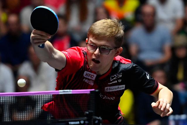 France's Alexis Lebrun hits a return to Sweden’s Truls Moregard during their the men's singles semi-final table tennis match of the World Table Tennis (WTT) Champions Montpellier 2025 at the Sud de France Arena in Perols, southern France on November 2, 2025. (Photo by Sylvain THOMAS / AFP)