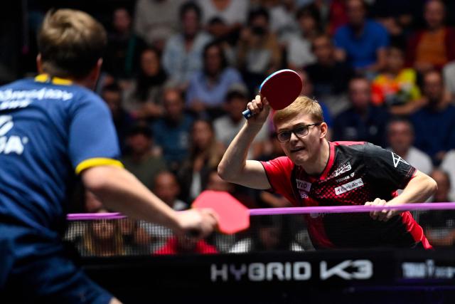 France's Alexis Lebrun (R) hits a return to Sweden’s Truls Moregard during their the men's singles semi-final table tennis match of the World Table Tennis (WTT) Champions Montpellier 2025 at the Sud de France Arena in Perols, southern France on November 2, 2025. (Photo by Sylvain THOMAS / AFP)