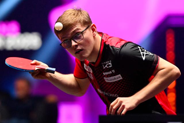 France's Alexis Lebrun eyes the ball as he serves to Sweden’s Truls Moregard during their men's singles semi-final table tennis match of the World Table Tennis (WTT) Champions Montpellier 2025 at the Sud de France Arena in Perols, southern France on November 2, 2025.  (Photo by Sylvain THOMAS / AFP)