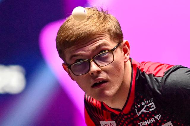France's Alexis Lebrun eyes the ball as he serves to Sweden’s Truls Moregard during their men's singles semi-final table tennis match of the World Table Tennis (WTT) Champions Montpellier 2025 at the Sud de France Arena in Perols, southern France on November 2, 2025.  (Photo by Sylvain THOMAS / AFP)