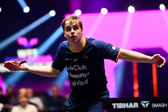 Sweden’s Truls Moregard eyes the ball as he serves to France's Alexis Lebrun during their men's singles semi-final table tennis match of the World Table Tennis (WTT) Champions Montpellier 2025 at the Sud de France Arena in Perols, southern France on November 2, 2025.  (Photo by Sylvain THOMAS / AFP)