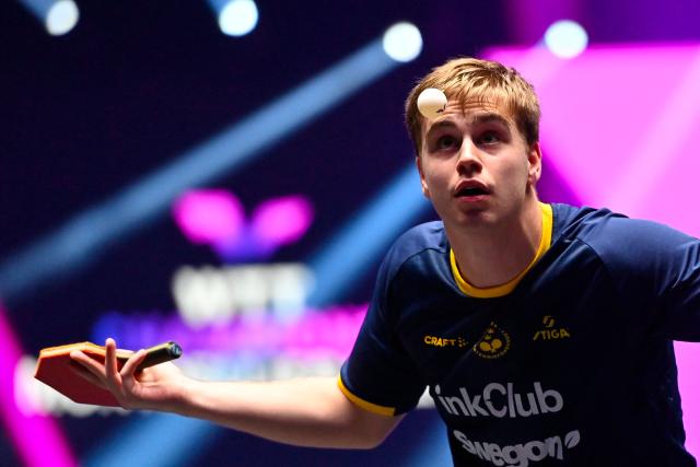 Sweden’s Truls Moregard eyes the ball as he serves to France's Alexis Lebrun during their men's singles semi-final table tennis match of the World Table Tennis (WTT) Champions Montpellier 2025 at the Sud de France Arena in Perols, southern France on November 2, 2025.  (Photo by Sylvain THOMAS / AFP)
