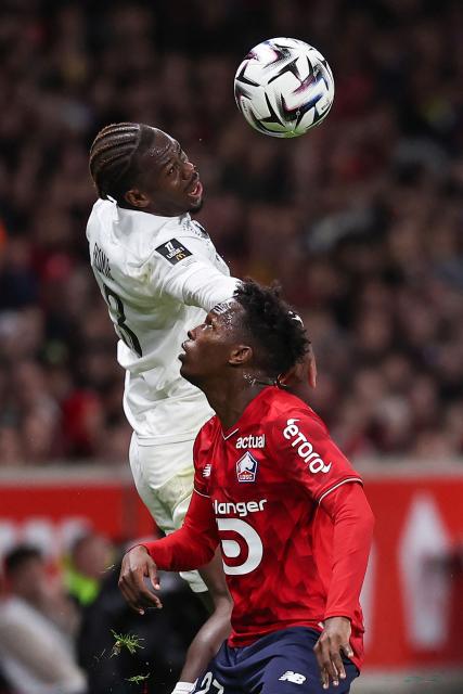 Angers' Gabonese defender #03 Jacques Ekomie (L) fights for the ball with Lille's Portuguese forward #27 Felix Correia during the French L1 football match between LOSC Lille and Angers SCO at Stade Pierre-Mauroy in Villeneuve-d'Ascq, near Lille on November 2, 2025. (Photo by Anne-Christine POUJOULAT / AFP)