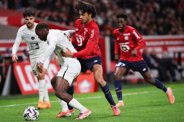 Angers' Gabonese defender #03 Jacques Ekomie (2nd L) fights for the ball with Lille's French midfielder #32 Ayyoub Bouaddi (2nd R) during the French L1 football match between LOSC Lille and Angers SCO at Stade Pierre-Mauroy in Villeneuve-d'Ascq, near Lille on November 2, 2025. (Photo by Anne-Christine POUJOULAT / AFP)