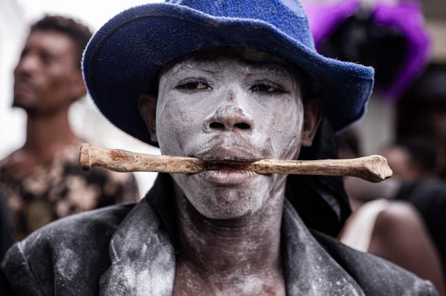 A man attends Fet Gede, the traditional Haitian Day of the Dead celebration at the Port-au-Prince cemetery, in Haiti, on November 2, 2025. Fet Gede is the annual celebration when practitioners of vodou parade and believe to be possessed by the spirits of the dead. (Photo by Clarens SIFFROY / AFP)