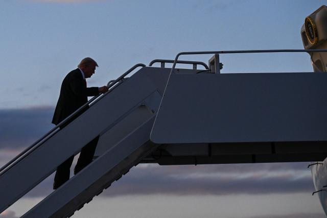 US President Donald Trump boards Air Force One at Palm Beach International Airport in West Palm Beach, Florida, on November 2, 2025. Trump is returning to the White House from his Mar-a-Lago, Florida, residence where he spent the weekend. (Photo by ROBERTO SCHMIDT / AFP)