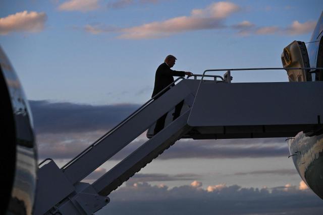 US President Donald Trump boards Air Force One at Palm Beach International Airport in West Palm Beach, Florida, on November 2, 2025. Trump is returning to the White House from his Mar-a-Lago, Florida, residence where he spent the weekend. (Photo by ROBERTO SCHMIDT / AFP)