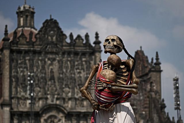 This view shows a huge statue in Zocalo during the annual Day of the Dead celebrations in Mexico City on November 2, 2025. A statue in the Zocalo square during the annual Day of the Dead celebrations in Mexico City on November 2, 2025. (Photo by CARL DE SOUZA / AFP)