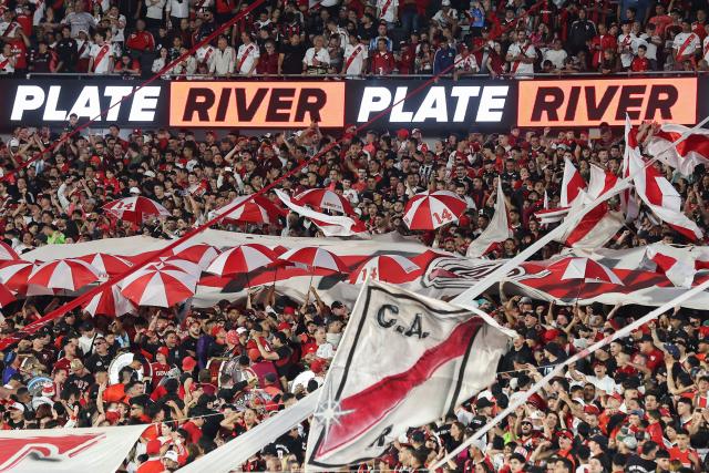 River Plate's fans cheer for their team during the Argentine Professional Football League 2025 Clausura Tournament match between River Plate and Gimnasia at the Mas Monumental Stadium in Buenos Aires on November 2, 2025. (Photo by ALEJANDRO PAGNI / AFP)