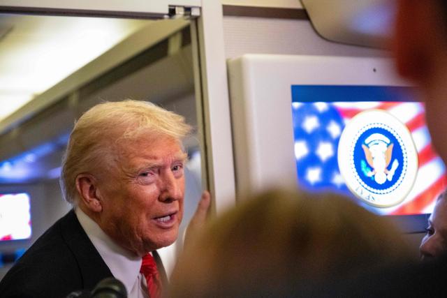 US President Donald Trump speaks to members of the press aboard Air Force One as he heads to Joint Base Andrews in Maryland after departing West Palm Beach, Florida on November 2, 2025. Trump is returning to the White House from his Mar-a-Lago, Florida, residence where he spent the weekend. (Photo by ROBERTO SCHMIDT / AFP)