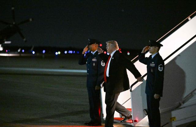 US President Donald Trump steps off Air Force One at Joint Base Andrews, Maryland, on November 2, 2025. Trump is returning to the White House from his Mar-a-Lago, Florida, residence where he spent the weekend. (Photo by ROBERTO SCHMIDT / AFP)