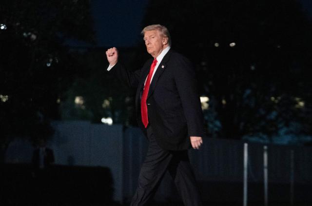 US President Donald Trump gestures as he walks on the South Lawn upon arrival at the White House in Washington, DC, on November 2, 2025. Trump is returning to the White House from his Mar-a-Lago, Florida, residence where he spent the weekend. (Photo by Allison ROBBERT / AFP)