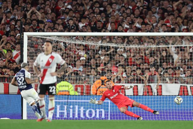 Gimnasia's forward #32 Marcelo Torres scores the opening goal from the penalty spot during the Argentine Professional Football League 2025 Clausura Tournament match between River Plate and Gimnasia at the Mas Monumental Stadium in Buenos Aires on November 2, 2025. (Photo by ALEJANDRO PAGNI / AFP)