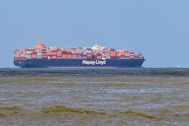 A cargo ship loaded with containers departs from the Colombo International Container Terminal (CICT) in Colombo on November 3, 2025. (Photo by Ishara S. KODIKARA / AFP)