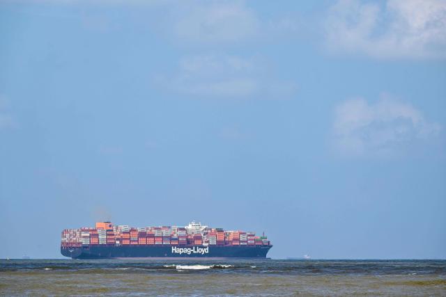A cargo ship loaded with containers departs from the Colombo International Container Terminal (CICT) in Colombo on November 3, 2025. (Photo by Ishara S. KODIKARA / AFP)
