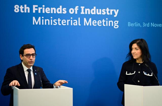 Stephane Sejourne (L), Executive Vice-President of the European Commission for Prosperity and Industrial Strategy, and German Economy and Energy Minister Katherina Reiche speak during the so-called "Friends of Industry Conference" on November 3, 2025 in Berlin, Germany. (Photo by Tobias SCHWARZ / AFP)