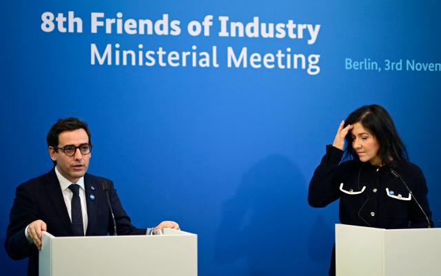 Stephane Sejourne (L), Executive Vice-President of the European Commission for Prosperity and Industrial Strategy, and German Economy and Energy Minister Katherina Reiche speak during the so-called "Friends of Industry Conference" on November 3, 2025 in Berlin, Germany. (Photo by Tobias SCHWARZ / AFP)