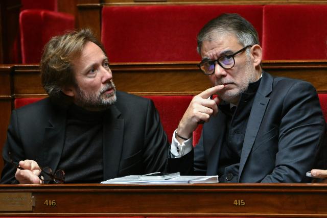 LtoR, President of Socialistes et Apparentes parliamentary group Boris Vallaud, Socialistes et Apparentes' MP Olivier Faure, Socialistes et Apparentes' MP Jerome Guedj and Socialistes et Apparentes' MP Francois Hollande attend a parliamentary debate focused on the 2026 budget at The National Assembly, France's lower house parliament, in Paris on November 3, 2025. (Photo by Bertrand GUAY / AFP)