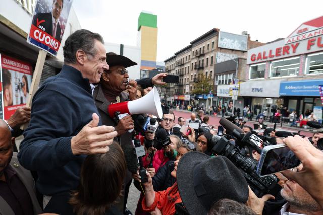 Former New York Governor Andrew Cuomo, independent candidate for New York City mayor, stands alongside former New York City Council member Ruben Diaz Sr., during a campaign stop in the Washington Heights neighborhood in the Manhattan borough of New York City on November 3, 2025. New Yorkers will pick a new mayor on November 4 after an unpredictable race that has drawn attention from far beyond the largest city in the United States, with President Donald Trump branding frontrunner Zohran Mamdani "a communist."  Breakout Democratic Party candidate Mamdani, a naturalized Muslim American who represents Queens in the state legislature, leads former governor and sex assault-accused Andrew Cuomo, running as an independent after losing his party's primary contest to Mamdani. (Photo by TIMOTHY A.CLARY / AFP)