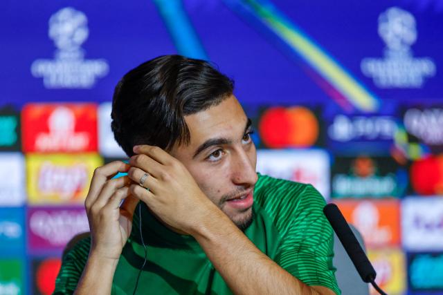 Union St-Gilloise's Belgian midfielder #10 Anouar Ait El Hadj gestures during a press conference on the eve of the UEFA Champions League league phase day 4 football match between Club Atletico de Madrid and Union St-Gilloise at the Metropolitano Stadium in Madrid on November 3, 2025. (Photo by Oscar DEL POZO / AFP)