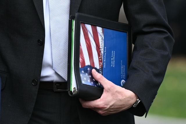 Todd Lyons, acting director of US Immigration and Customs Enforcement (ICE), walks toward the West Wing after participating in a television interview outside the White House on November 3, 2025, in Washington, DC. (Photo by Brendan SMIALOWSKI / AFP)