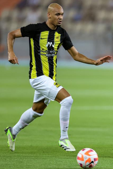 (FILES) Ittihad's Brazilian midfielder #08 Fabinho runs with the ball during the Saudi Pro League football match between Al-Ittihad and Al-Hilal at Prince Abdullah al-Faisal Stadium in Jeddah on September 1, 2023. The appearance of striker Vitor Roque and the return of Fabinho after almost three years of absence are new additions to the squad announced by Brazil on November 3, 2025 for this month's friendlies against Senegal and Tunisia. (Photo by AFP)