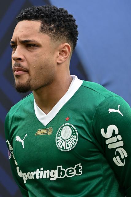 (FILES) Palmeiras' forward #09 Vitor Roque listens to Brazilian anthem before the Brasileirao Serie A football match between Flamengo and Palmeiras at Maracana Stadium in Rio de Janeiro, Brazil on October 19, 2025. The appearance of striker Vitor Roque and the return of Fabinho after almost three years of absence are new additions to the squad announced by Brazil on November 3, 2025 for this month's friendlies against Senegal and Tunisia. (Photo by Mauro PIMENTEL / AFP)