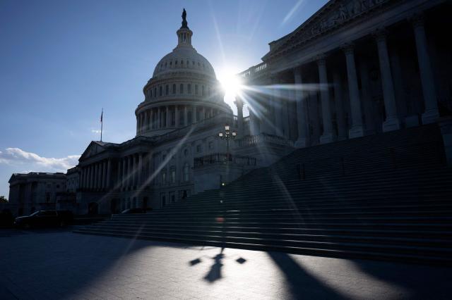 Sun sets on the 34th day of the government shutdown on Capitol Hill in Washington, DC, on November 3, 2025. The federal government shutdown has entered its second month. Since partisan gridlock sent the US government into shutdown October 1, many federal workers have gone without paychecks and millions of Americans are increasingly caught in the crossfire of a lack of basic federal services. (Photo by Jim WATSON / AFP)