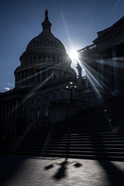 Sun sets on the 34th day of the government shutdown on Capitol Hill in Washington, DC, on November 3, 2025. The federal government shutdown has entered its second month. Since partisan gridlock sent the US government into shutdown October 1, many federal workers have gone without paychecks and millions of Americans are increasingly caught in the crossfire of a lack of basic federal services. (Photo by Jim WATSON / AFP)