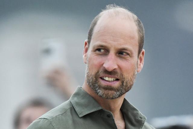 Britain's Prince William, Prince of Wales, looks on during a meeting with first responders at Copacabana Beach in Rio de Janeiro, Brazil, on November 3, 2025. Prince William visits Brazil to host the Earthshot Prize awards and will later attend the UN COP30 climate summit on behalf of King Charles. (Photo by Daniel RAMALHO / AFP)