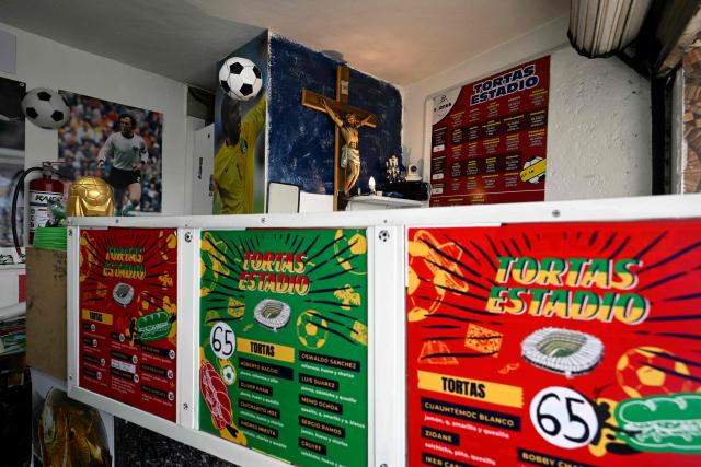 A view of the Mexican restaurant "Tortas Estadio," located in front of the Azteca Stadium in the Santa Ursula neighborhood in Mexico City, taken on October 9, 2025. While millions celebrate Mexico hosting the FIFA World Cup for a third time, entire families of street vendors watch with concern as the football festivities threaten their long-standing source of income. (Photo by Alfredo ESTRELLA / AFP)